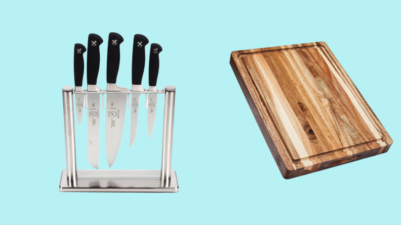 Knive set in block and cutting board against cyan background