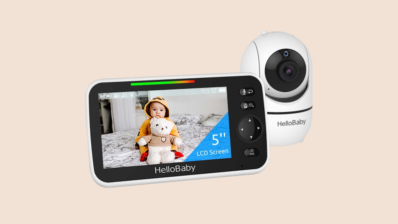 Front view of a white-hued HelloBaby baby monitor screen and camera on a tan background.