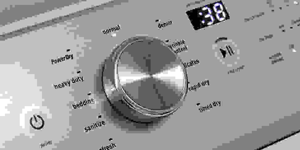 A close-up shot of a dryer's cycle selection dial.
