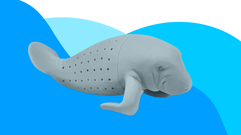 A gray silicone tea strainer shaped like a manatee is silhouetted against a blue and white background.