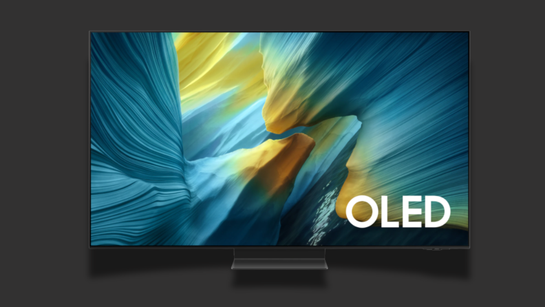 A TV with a colorful screen sits on a black background
