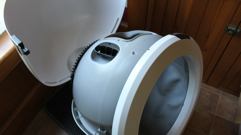 A Litter-Robot 4 with its globe in place and the bonnet open.