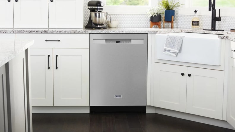 The Maytag MDB4949SKZ dishwasher in a white kitchen.