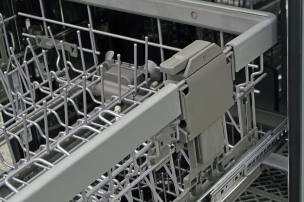 Height adjustment switch on the upper rack