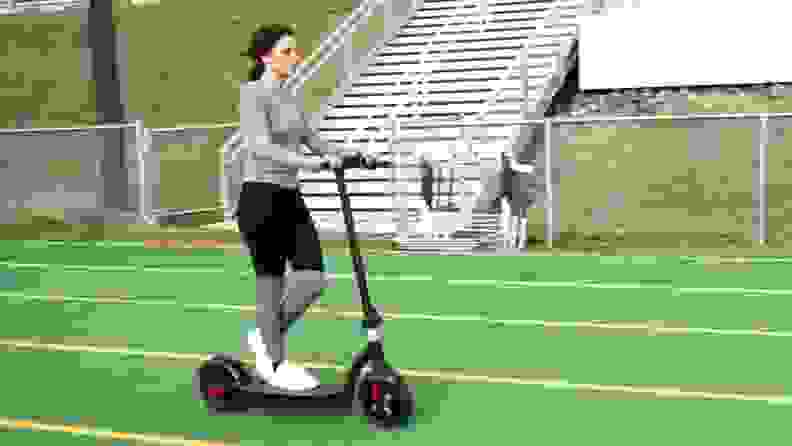 A person works out on a Hover-1 outside.