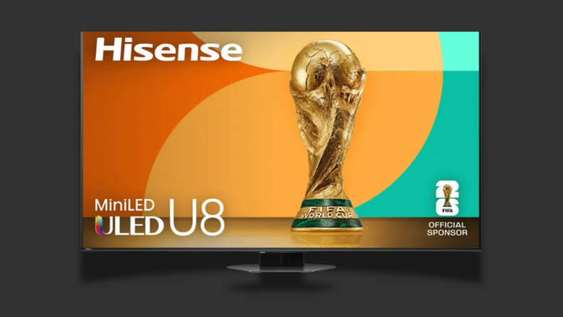 A TV with a colorful screen sits on a black background