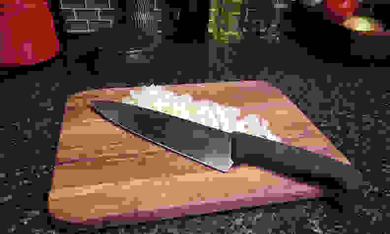 A knife on a cutting board.