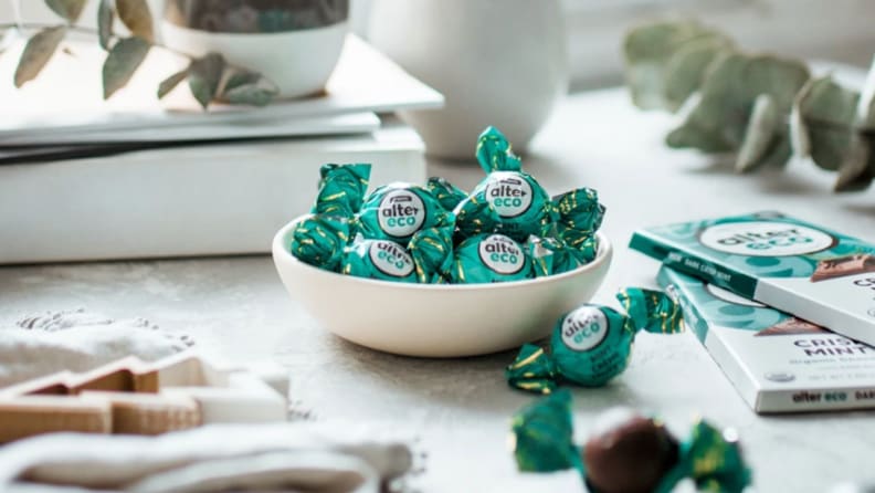 A tray of truffles wrapped in green and white