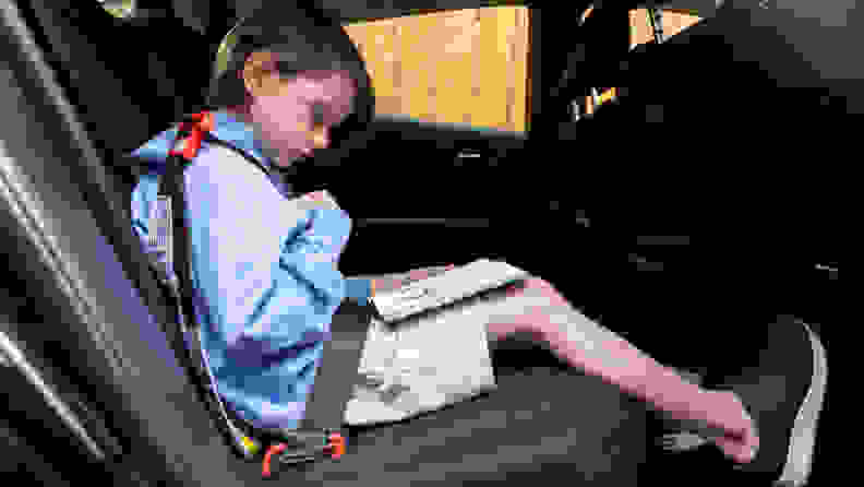 A child sits in a Mifold seat.