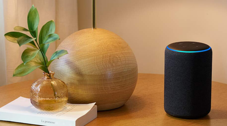 An Amazon Echo Plus (second-generation) smart speaker sits on a table.
