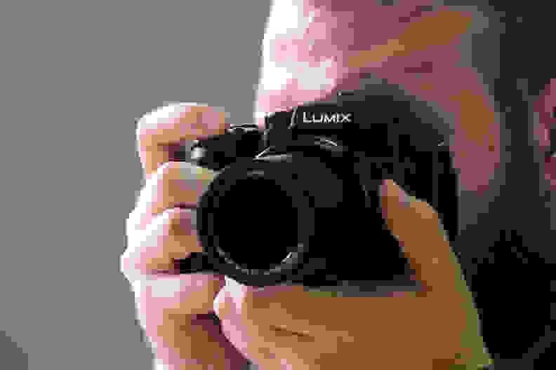 A photo of the Panasonic Lumix FZ300 being used.