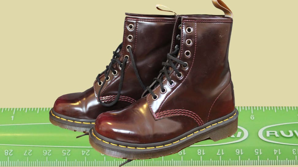 Maroon Dr. Marten boots on a green ruler