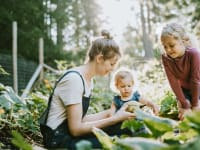 Mother in garden with two kids
