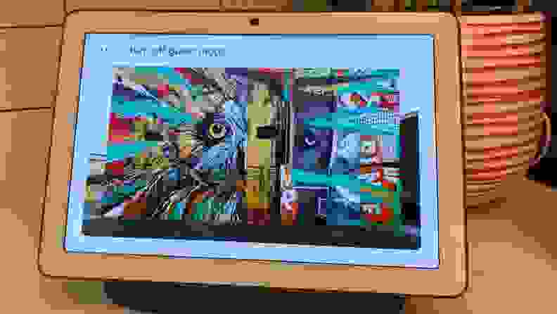 A work of street art is displayed on an iPad. At the top of the display, the a prompt reads, "Turn off guest mode."