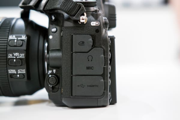 The D750 has remote, headset, microphone, USB, and HDMI connections.
