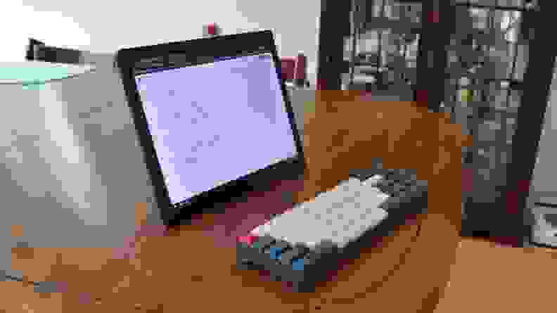 A detachable laptop sits on a desk