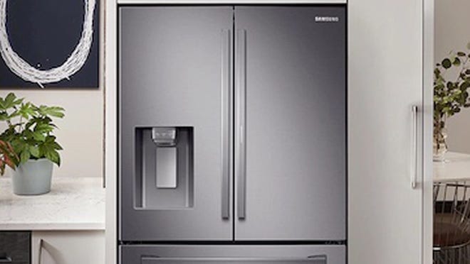 Stainless steel double door refrigerator in kitchen