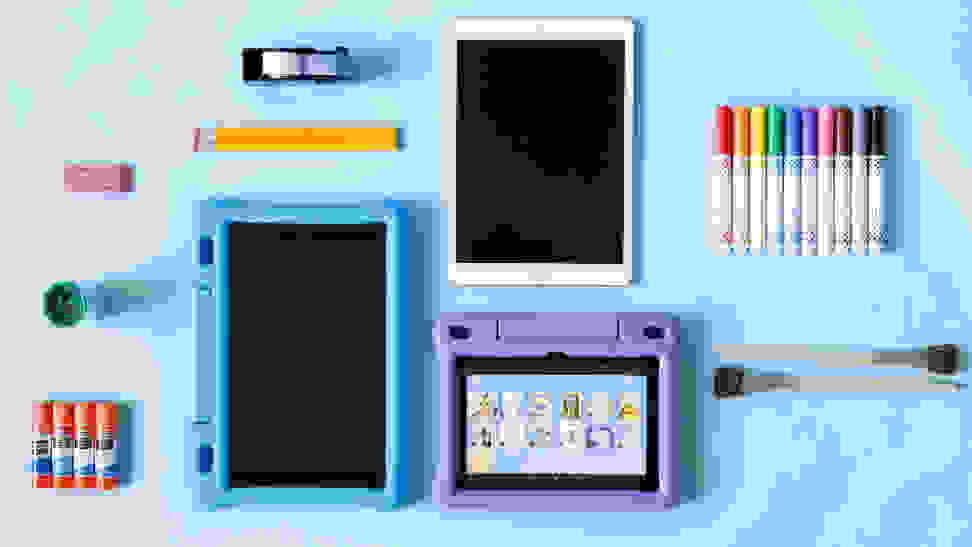 An image of two Kindles and one iPad on a blue background surrounded by school supplies.