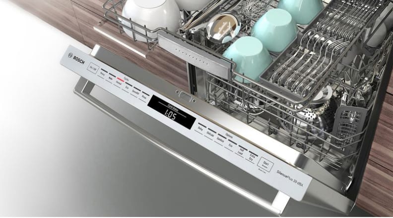 A shot of the Bosch 800 dishwasher, with its door pulled slightly open, showcasing its top-facing control panel.