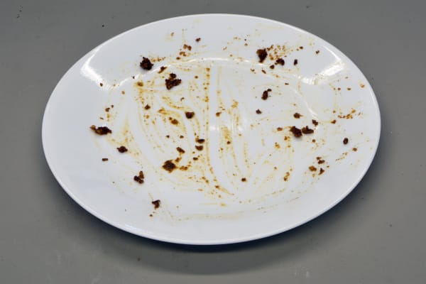 A plate stained with meat