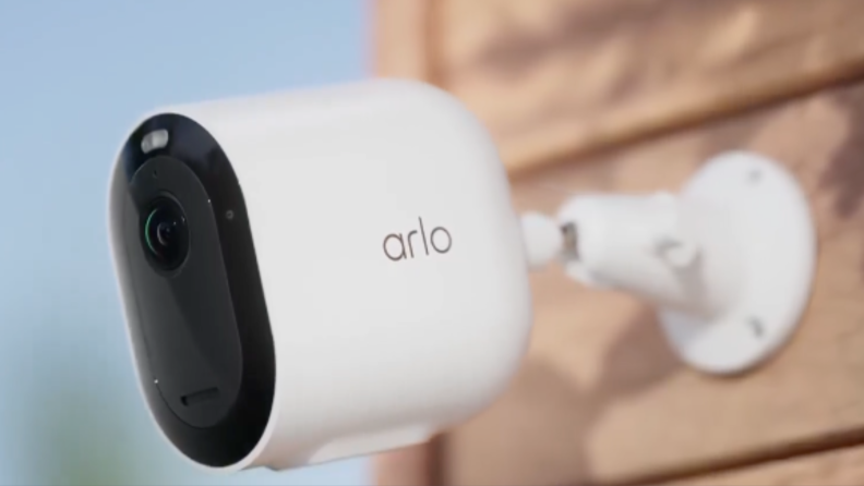 The Arlo Pro 5S 2K security camera on the side of a house