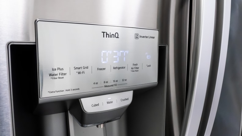 A close-up of the through-the-door ice and water dispenser on the LG LRMVS3006S French door refrigerator.