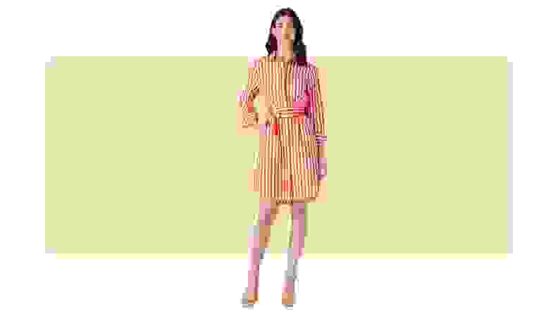 A white and red striped shirtdress that ties at the waist.