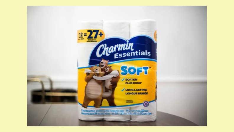 Rolls of Charmin Essentials Soft sit on a table