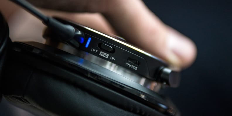 The left earcup houses the switch for ANC as well as the charging port.