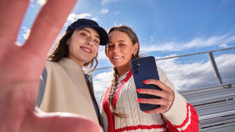 2 girls holding Gabb Phone 4 Pro