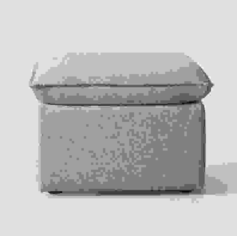 A gray storage ottoman