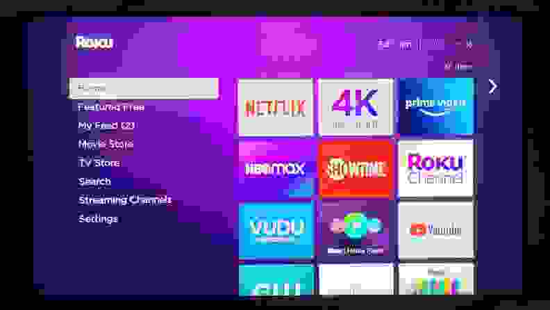 The Roku menu is shown on TV screen, with multiple streaming app squares against a purple background.