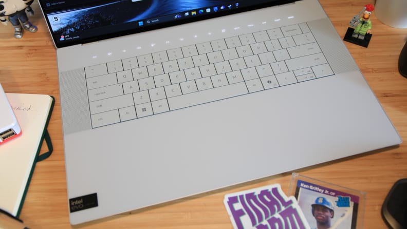 A close-up of the Dell XPS 16 laptop's keyboard on a desktop.