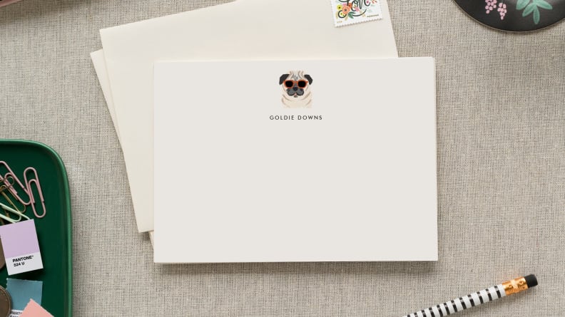 An image of a personalized notecard featuring a small illustration of a dog.