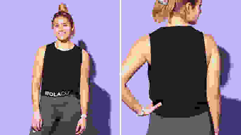 A person wearing the Wolaco Clinton muscle tank top in black.