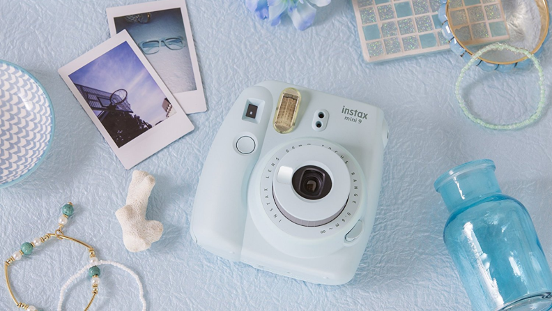 Fujifilm Instax Mini 9 camera on a table