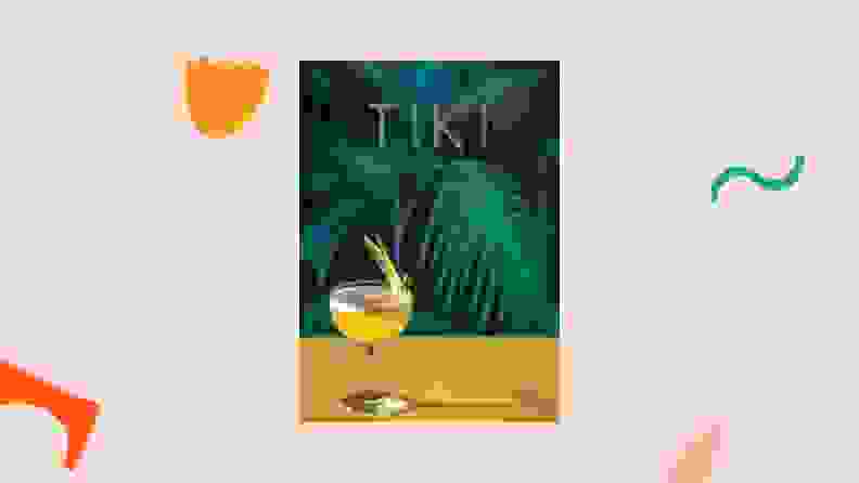 Tiki cookbook against a light pink background.