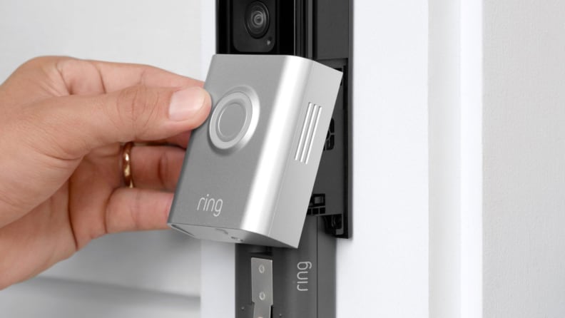 A close-up of a Ring doorbell being installed, showing how easy it is to set up Ring cameras at home.