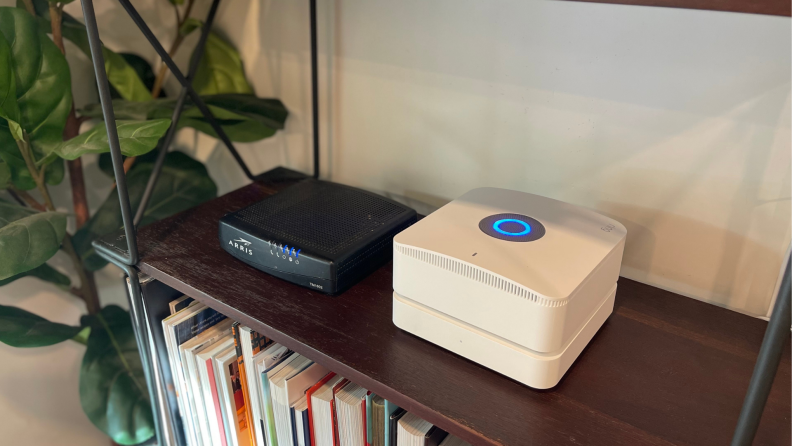 The Ring Alarm Pro Base Station sits next to modem