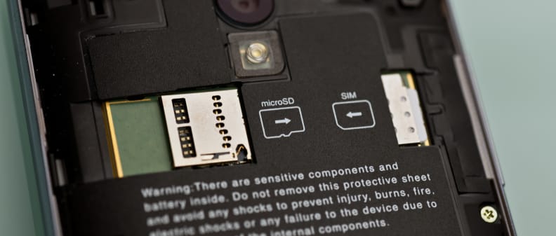 A photo of the Sharp Aquos Crystal's microSD card slot and SIM card slot.