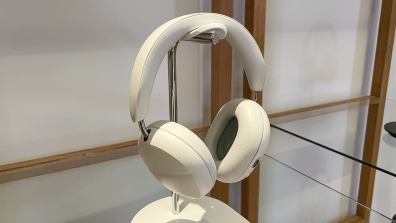 A white pair of Sonos Ace headphones on display.