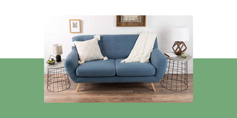 Image of a sofa flanked by two basket tables from Lavish Home.