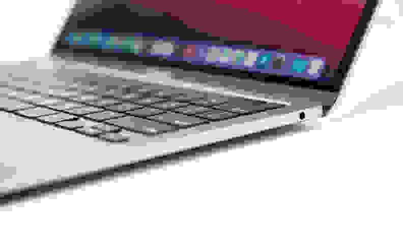 The outermost edge of a MacBook, largely out of focus except for the delete key and a few others.