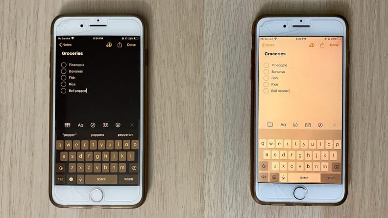 iphone on table with dark mode on and off