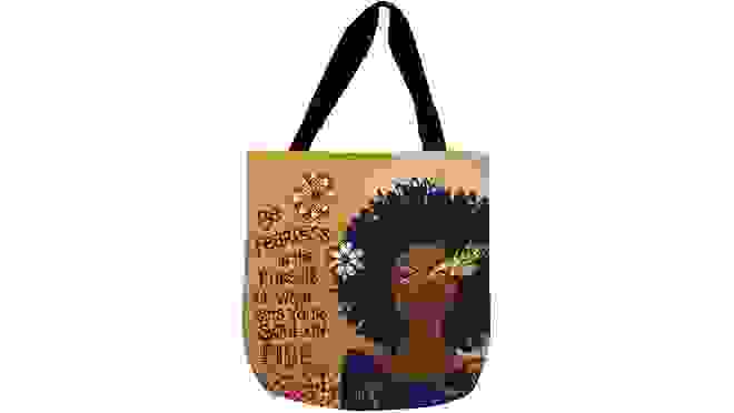 A tote bag featuring a painting of a Black woman.