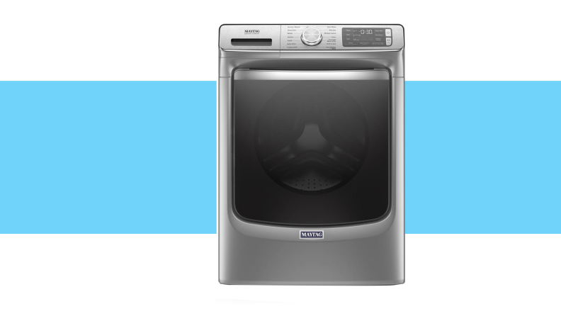 Grey washing machine on blue background