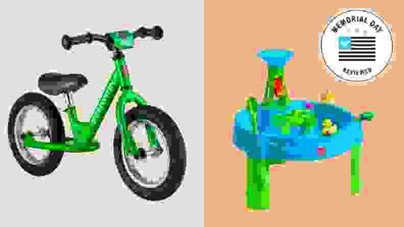 A kid's bicycle shown next to a water activity table for kids.