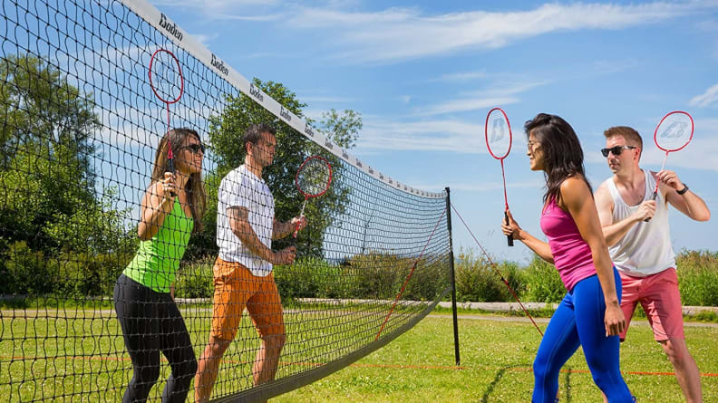 People play badminton outside.