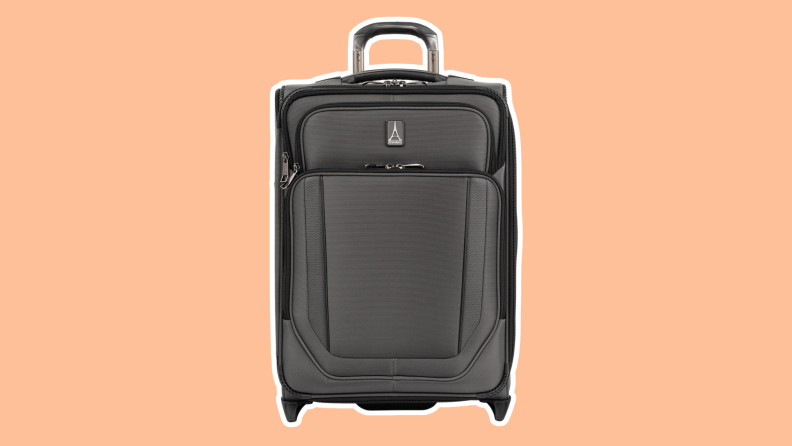 The Travelpro Crew VersaPack Global Carry-On Expandable Rollaboard on an orange background.