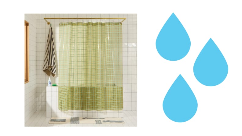 A green shower curtain in a bathroom